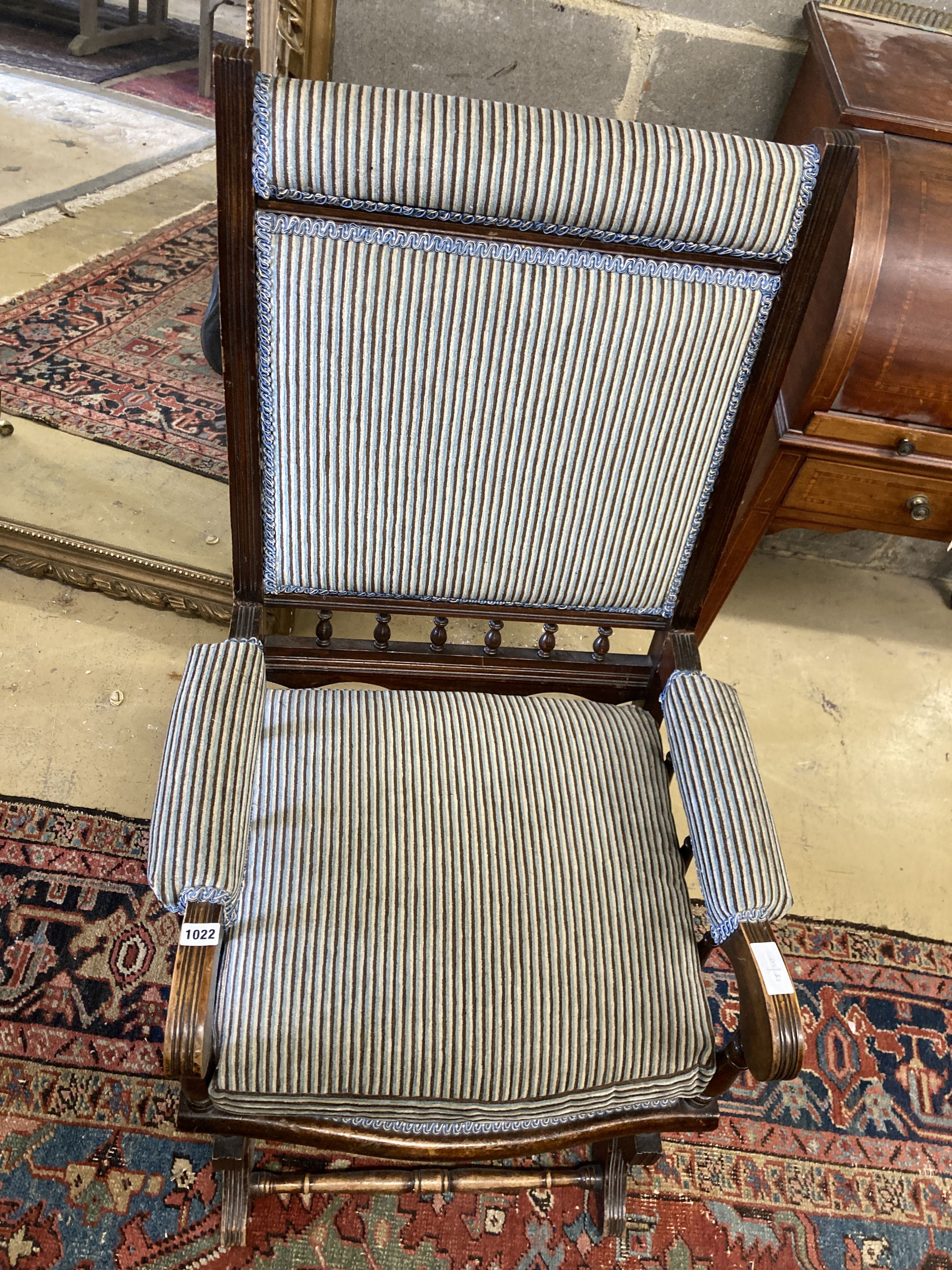 An early 20th century American mahogany rocking chair, width 60cm, depth 52cm, height 108cm